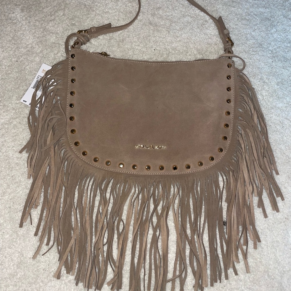 Michael kors purse with fringe and gold studs!Super cute and on trend!Never worn